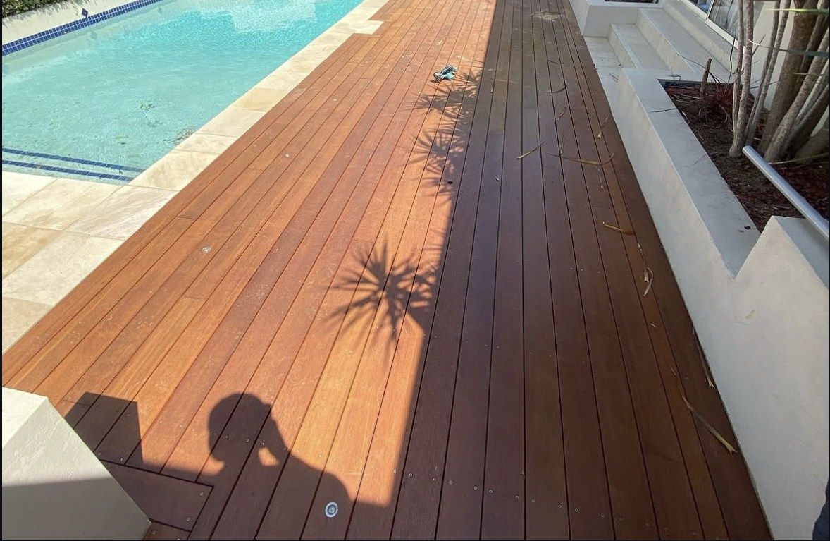 Timber deck running beside a residential swimming pool